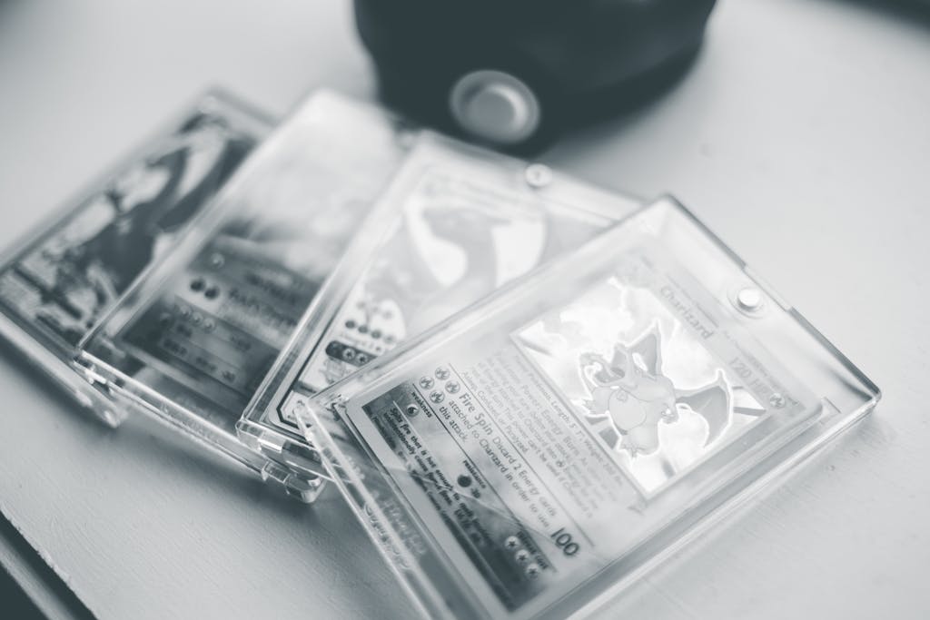 Close-up of collectible Pokemon cards in protective cases, emphasizing preservation and value.